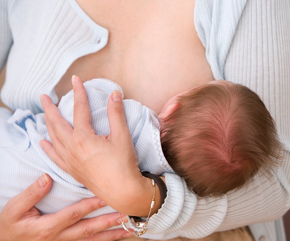 woman breastfeeding child