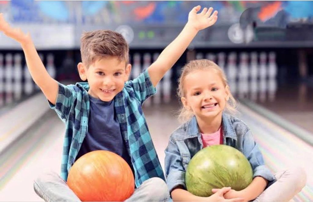 Small boy and girl bwling at Tweed Coolangatta TenPin Bowling