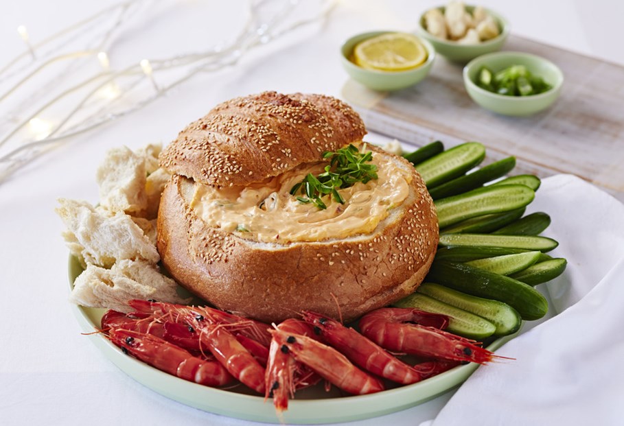 Sweet Chilli Cob Loaf Dip served with sliced cumbers, crispy bread and fresh cooked prawns.