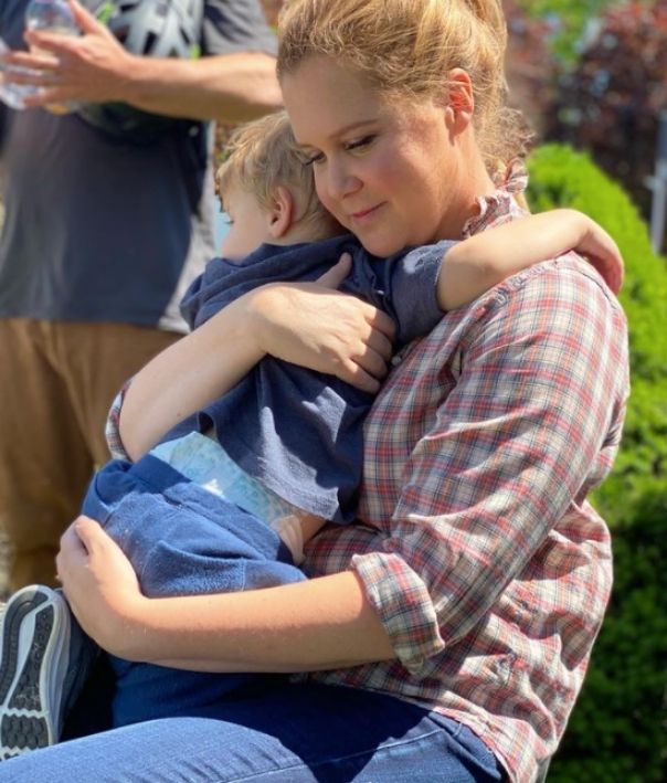 Amy Schumer hugging her son