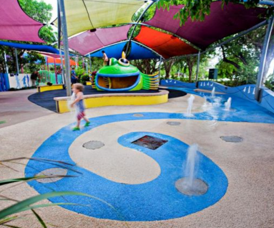 Small child plays at the facilities at Muddy's playground in Carins