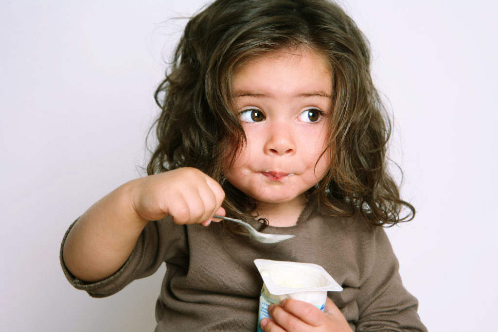 Girl eating yogurt