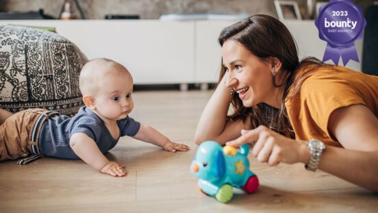 Mum and baby playing on floor