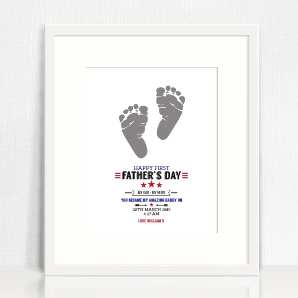 Print of baby footprints and wording in a white frame for Father's Day