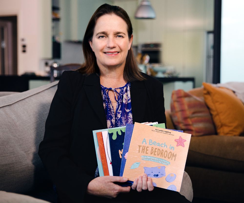 Professor Harriet Hiscock with a selection of books from the Sleep with Kip books