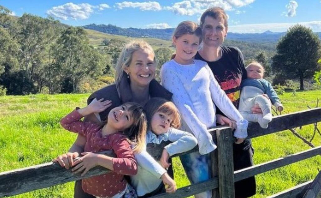 Libby Trickett with her husband and four children in the countryside