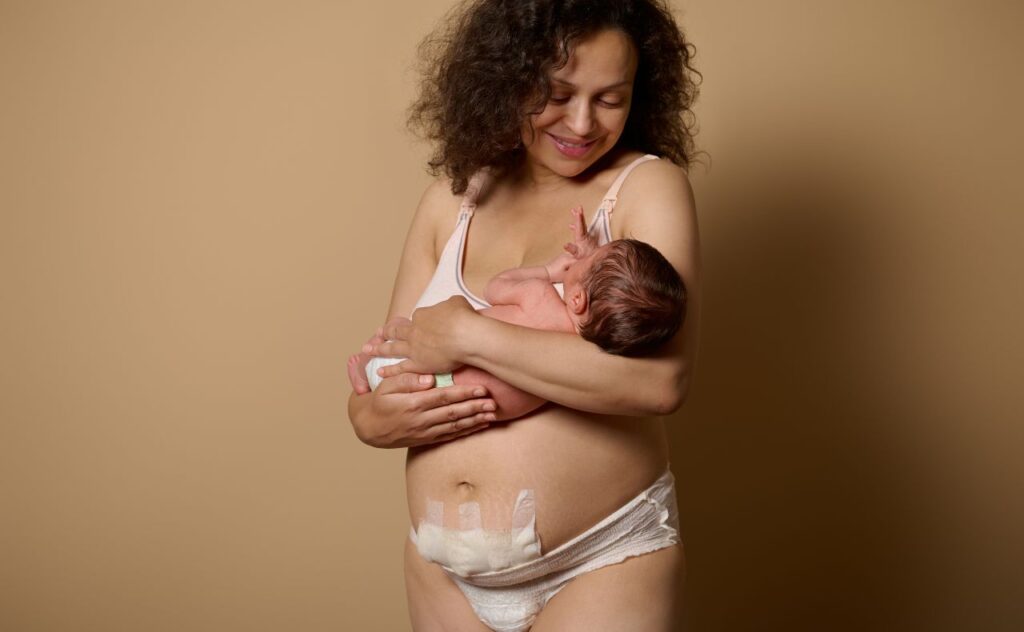 mother standing together with her newborn baby. Real body of women after childbirth with c-section scar