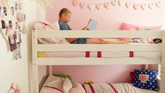 Bunk Beds Safety: Girl reading on top bunk