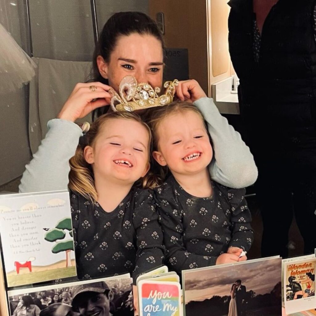 Dana Stephensen puts her ballet costume crown on Lulu and Lottie's heads