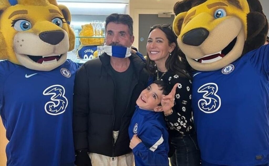 TV host Simon Cowell with wife and child