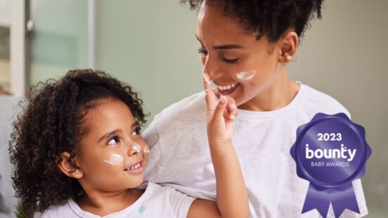 Mother daughter applying face cream