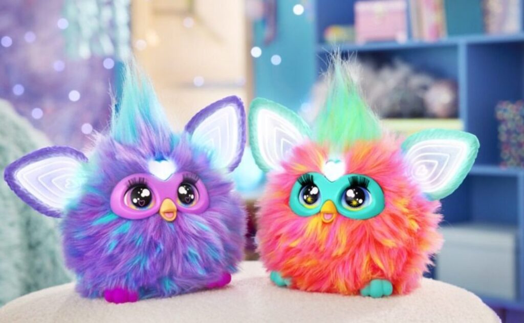 Two brightly coloured Furby toys