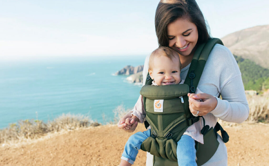 black friday sales - Woman with baby in ergobaby baby carrier.