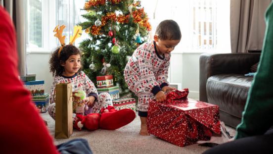 Children opening presents on Christmas morning