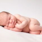 Small, cute newborn baby with perfect skin