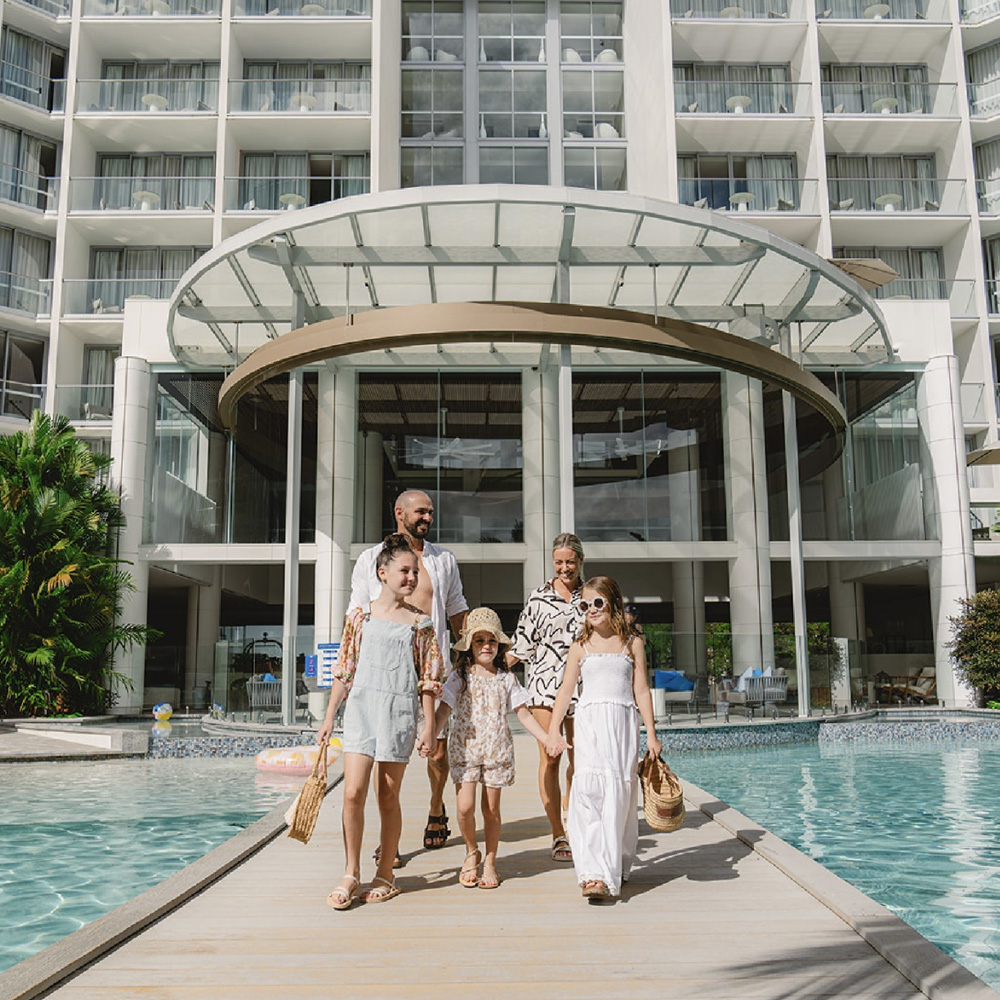 Family enjoying pool at Crystalbrook Riley Cairns