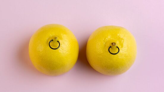 Two lemons with 'nipple' rings