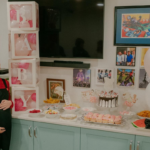 Caterina Mete, a Red Wiggle, surrounded by pink at the Wiggles baby shower for her twin girls