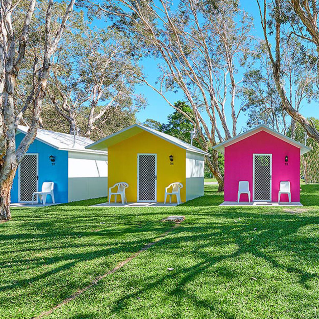 Coloured cabins at Glen Villa Byron Bay