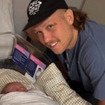 Queensland State of Origin star Reuben Cotter and new baby son in the hospital after birth