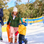 Family enjoying snow at Corin Forest