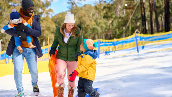 Family enjoying snow at Corin Forest