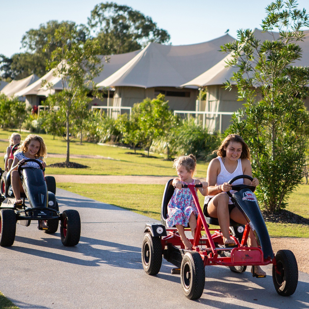 Family riding go karts at Rivershore resort