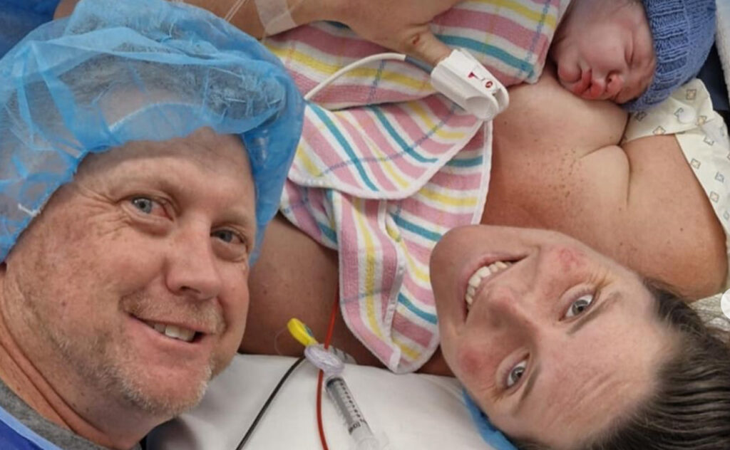 Retired three-time Australian Olympian Alicia Coutts with her husband and newborn son Hugo after birth in the hospital