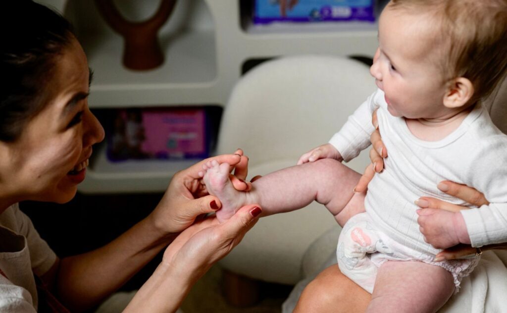 Anna Robards with daughter Ruby at Huggies Toddler Skin spa