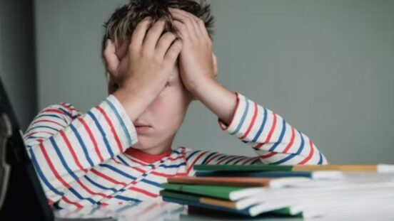 Child tired and bored of doing homework, kid stressed from learning indoors