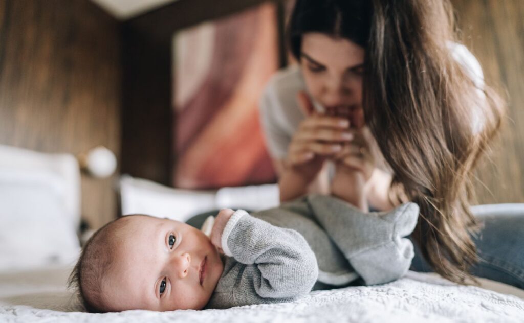 Mother kissing baby's feet