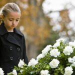 Girl/ child attending a funeral