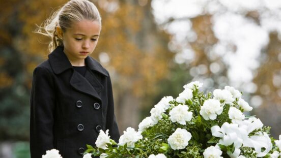 Girl/ child attending a funeral