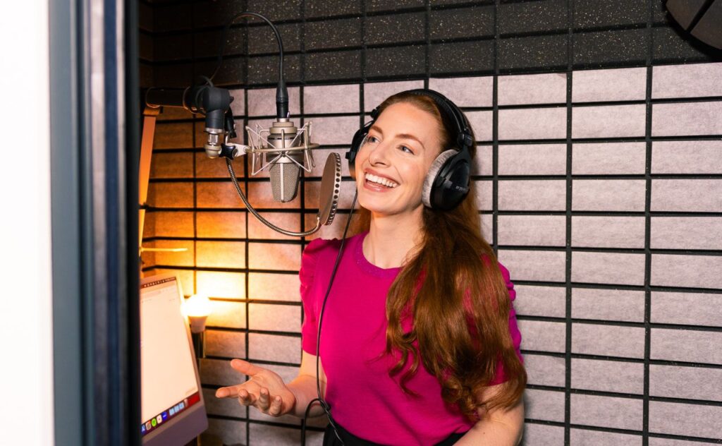 Emma Watkins in the studio recording launch of A Dream for Every Night Audible book series.