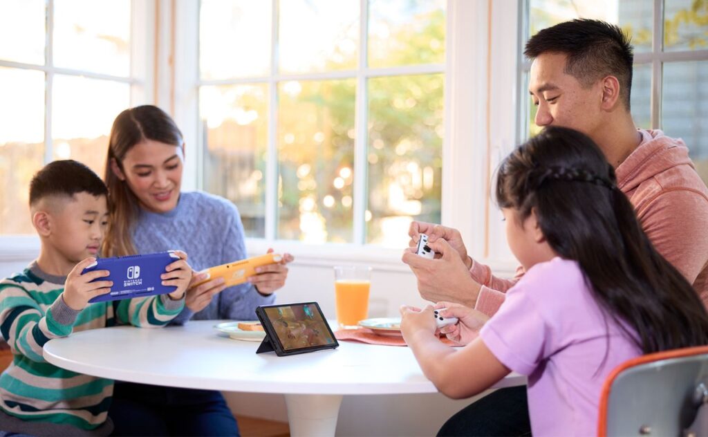 Family of four playing Nintendo Switch together