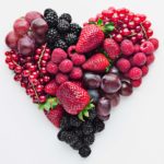 Fruit and berries arranged in a love heart